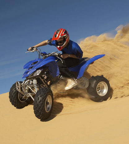 Man on 4-wheeler in desert